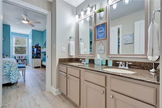 bathroom featuring ceiling fan, vanity, and hardwood / wood-style flooring