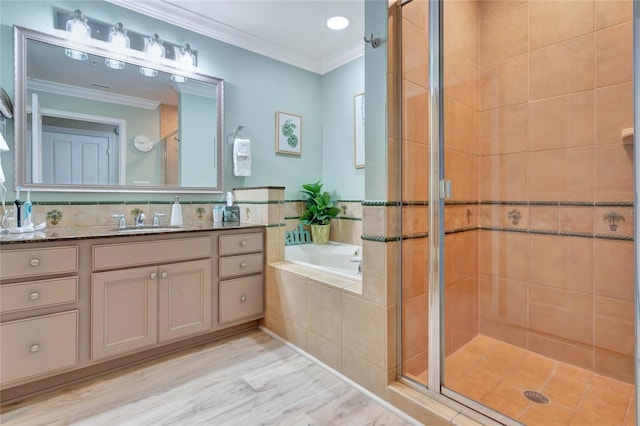 bathroom with independent shower and bath, crown molding, and vanity