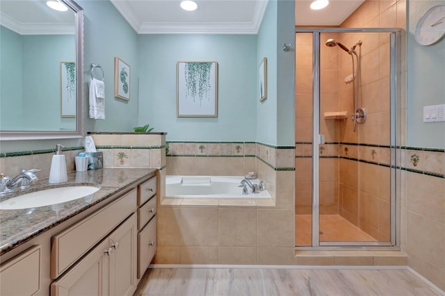 bathroom with vanity, crown molding, and shower with separate bathtub