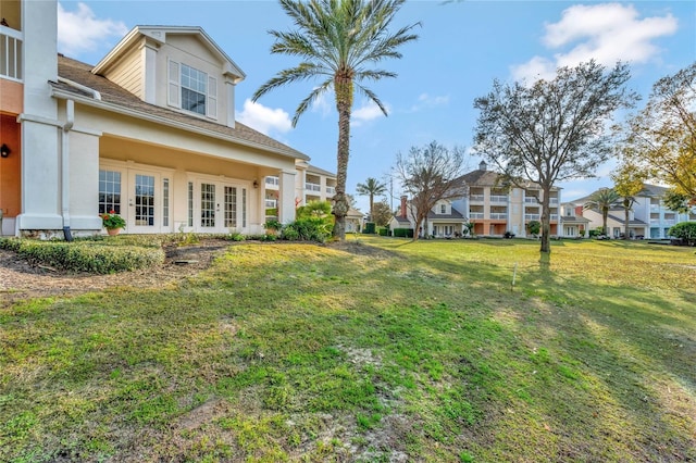 view of yard featuring french doors