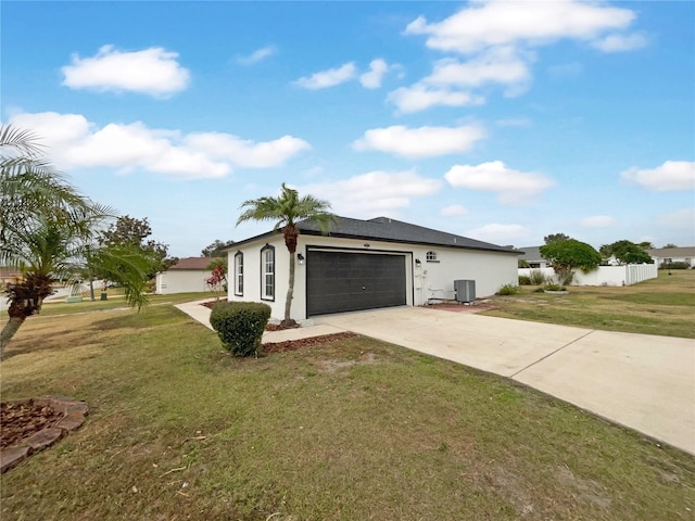 ranch-style home with central AC unit, a front lawn, and a garage