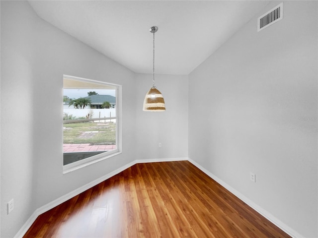 unfurnished dining area featuring hardwood / wood-style flooring