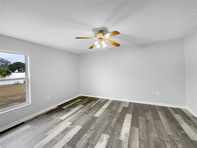 empty room featuring a textured ceiling, ceiling fan, and hardwood / wood-style floors