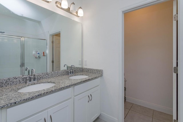 bathroom with vanity, tile patterned flooring, and a shower with shower door