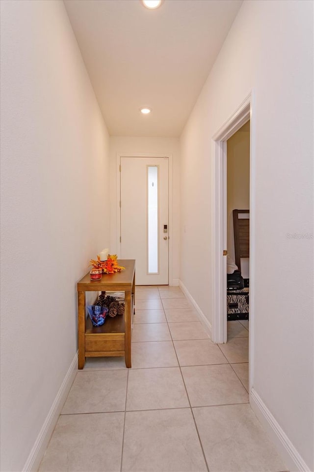 doorway featuring light tile patterned floors