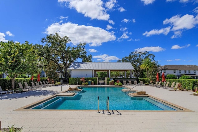 view of swimming pool featuring a patio area