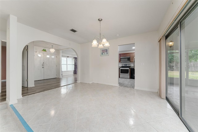 interior space featuring a chandelier