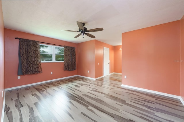 spare room with light hardwood / wood-style floors and ceiling fan