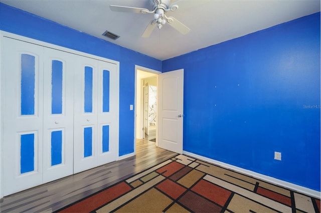 interior space featuring dark hardwood / wood-style floors and ceiling fan