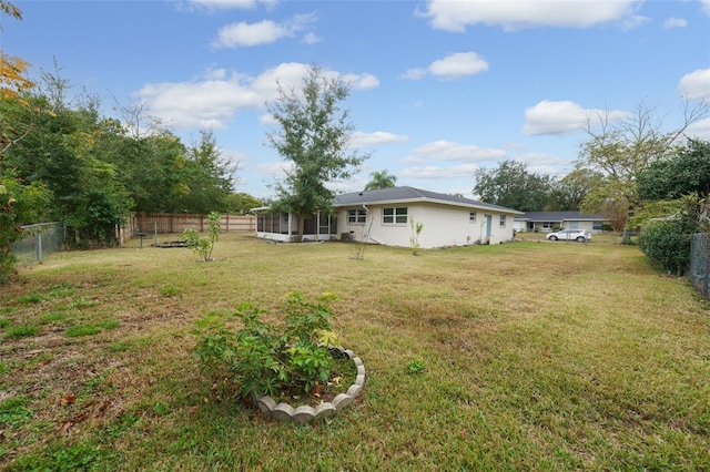 view of yard featuring a sunroom