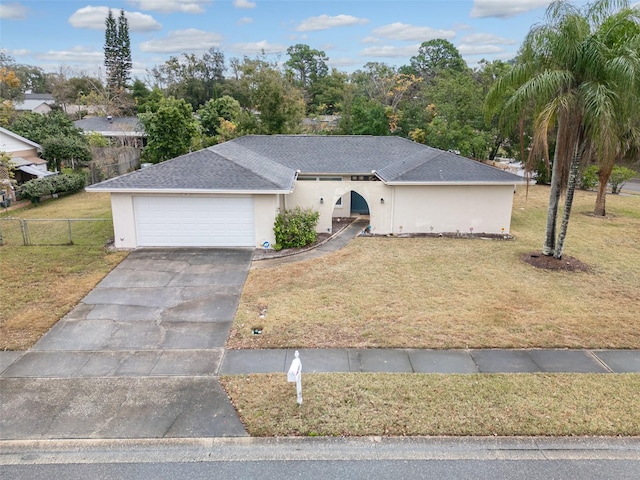 single story home featuring a garage and a front lawn