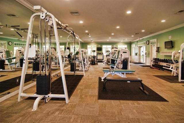 gym with carpet and crown molding