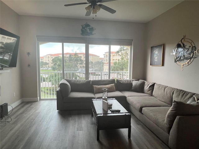 living room with ceiling fan and wood-type flooring