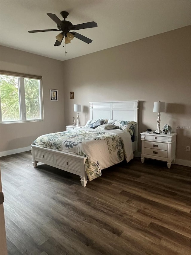 bedroom featuring ceiling fan and dark hardwood / wood-style flooring