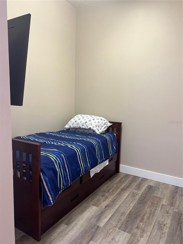 bedroom featuring hardwood / wood-style flooring