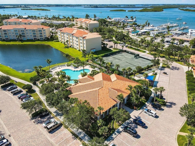 birds eye view of property with a water view