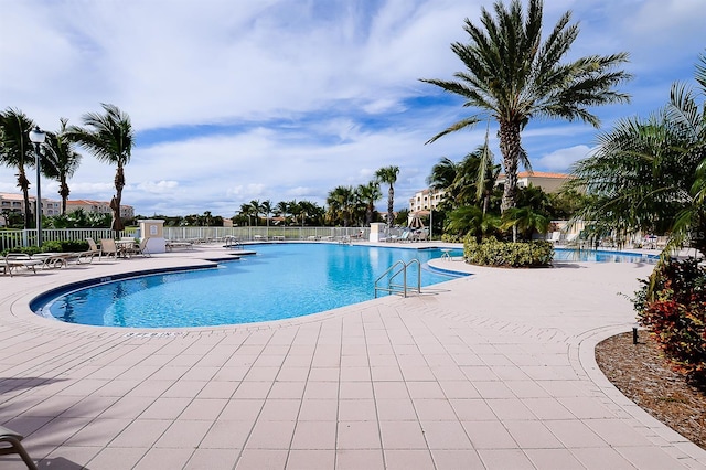 view of swimming pool featuring a patio