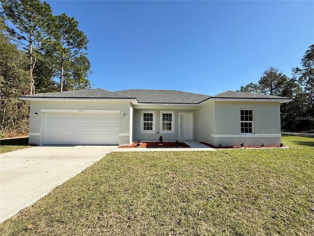 ranch-style house featuring a front lawn and a garage