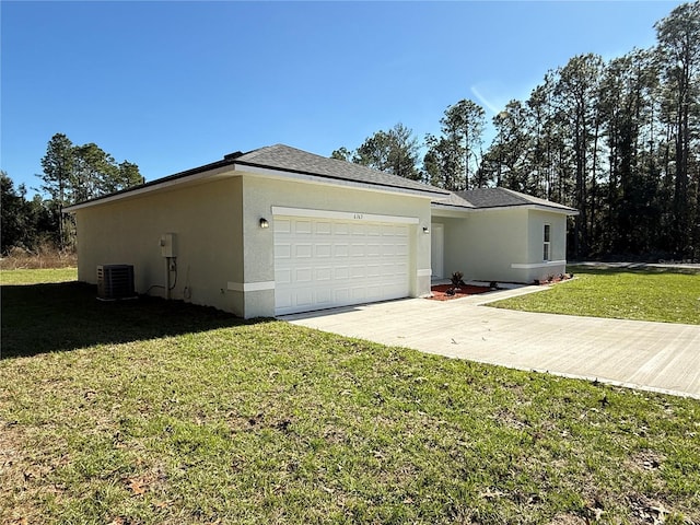 view of property exterior with central air condition unit, a lawn, and a garage