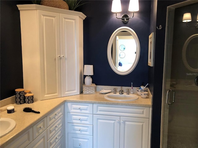 bathroom featuring an enclosed shower and vanity