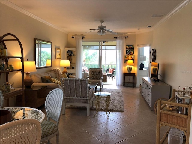 living room with a ceiling fan, visible vents, crown molding, and tile patterned floors