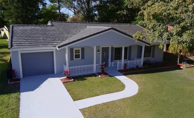 ranch-style home featuring a front yard, a garage, and covered porch