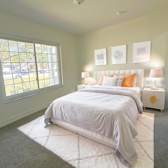 bedroom featuring carpet