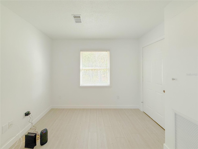 empty room featuring light hardwood / wood-style flooring