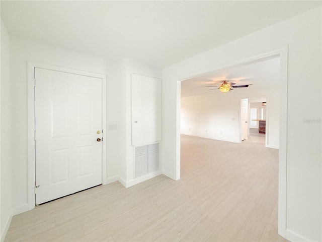 spare room with light hardwood / wood-style flooring and ceiling fan