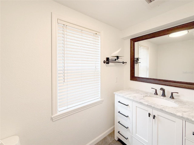 bathroom with a wealth of natural light and vanity