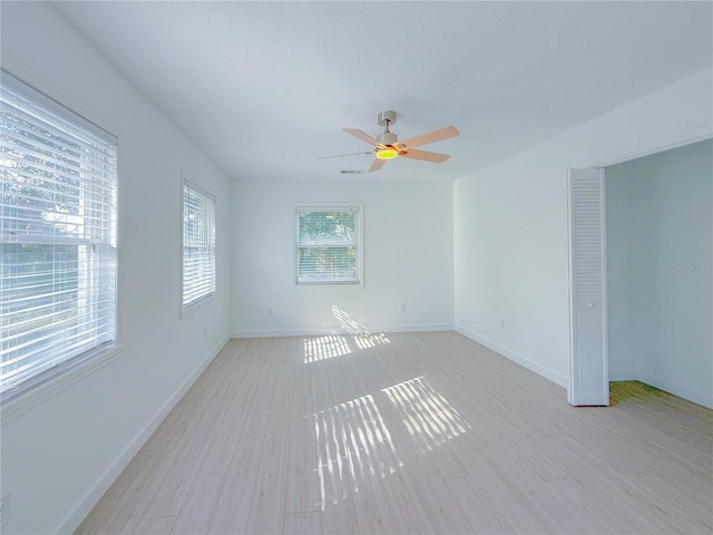 spare room featuring ceiling fan and light wood-type flooring