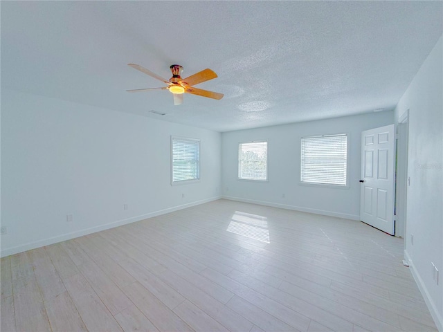 unfurnished room with light hardwood / wood-style floors and ceiling fan