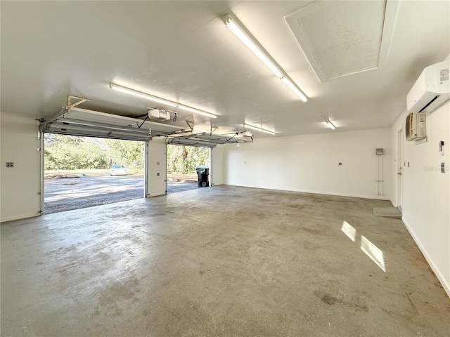 garage featuring a garage door opener and a wall unit AC