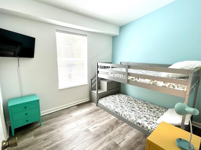 bedroom with hardwood / wood-style flooring