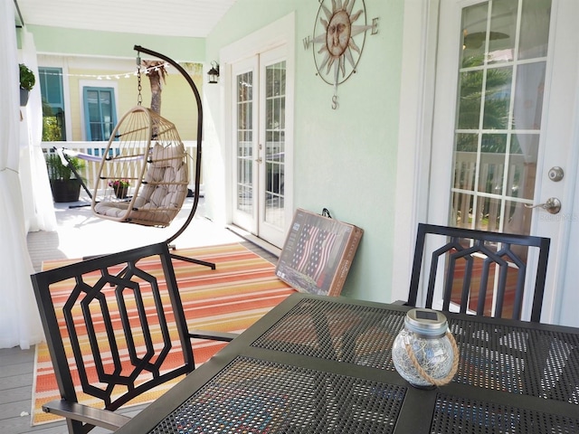 balcony featuring french doors and covered porch