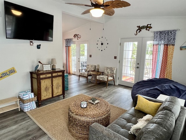 living room featuring french doors, vaulted ceiling, and hardwood / wood-style flooring