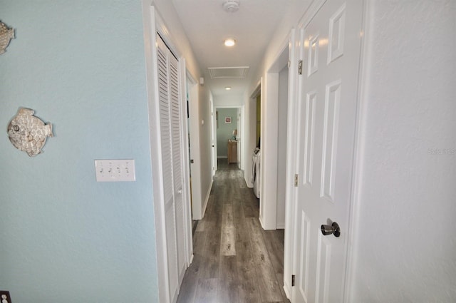 hall with dark wood-type flooring