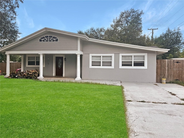 view of front facade with a porch and a front lawn