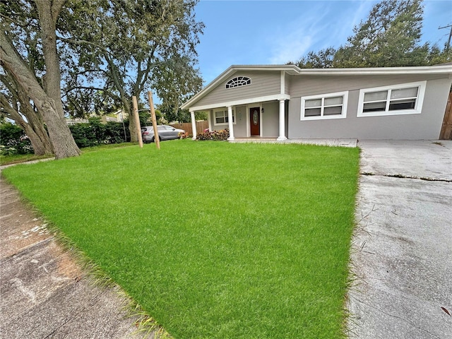 view of front of property with a porch and a front lawn