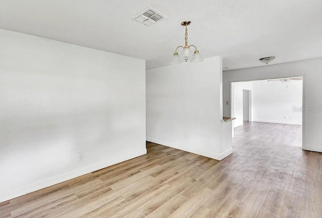 unfurnished room with light hardwood / wood-style flooring