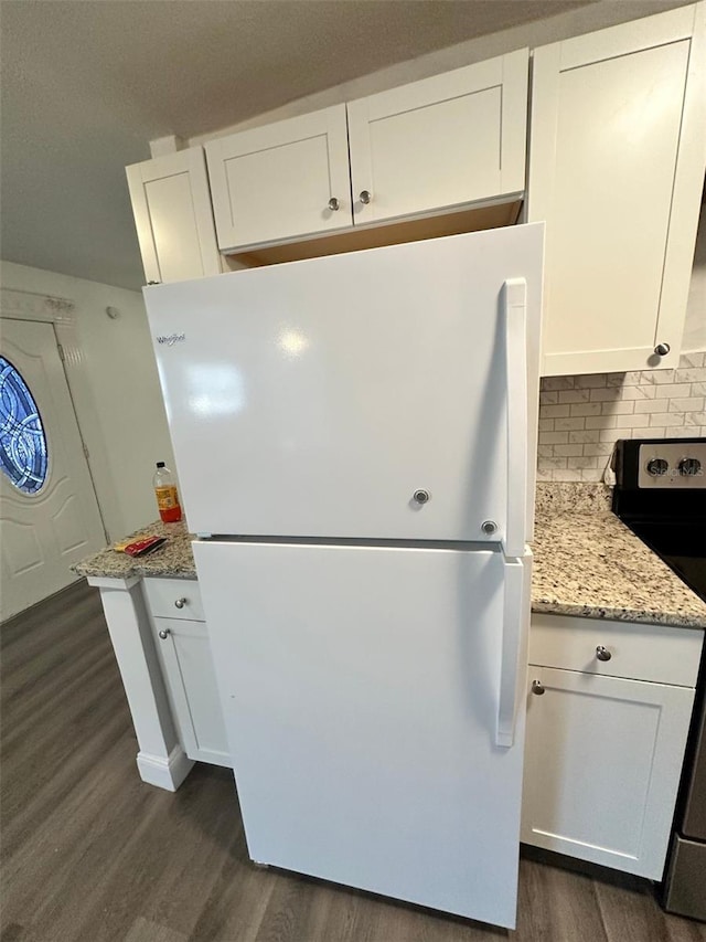 kitchen with white cabinets, backsplash, electric range, and white refrigerator