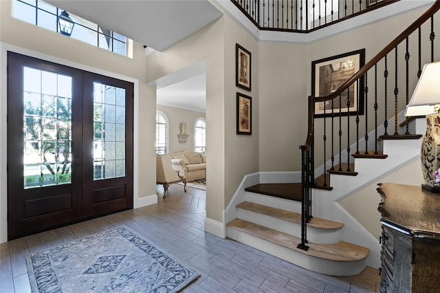 foyer with a high ceiling and french doors