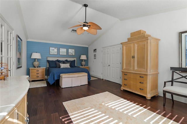 bedroom with ceiling fan, a closet, dark hardwood / wood-style flooring, and vaulted ceiling