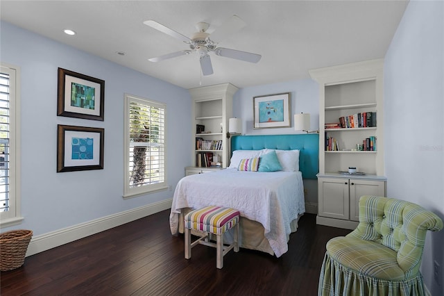 bedroom with ceiling fan and dark hardwood / wood-style flooring