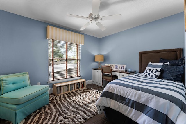 bedroom featuring ceiling fan and dark hardwood / wood-style floors