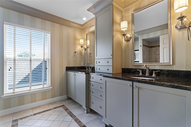 bathroom featuring tile patterned floors, vanity, and ornamental molding