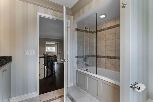 bathroom featuring tiled shower / bath combo, vanity, ornamental molding, and tile patterned flooring