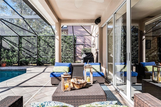 view of patio / terrace featuring ceiling fan, an outdoor living space, and glass enclosure