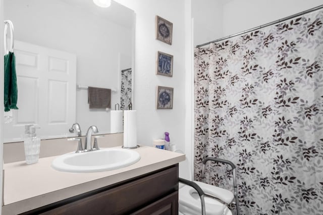 bathroom featuring vanity and a shower with shower curtain