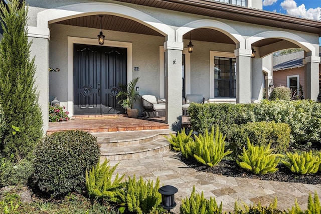 property entrance featuring a porch